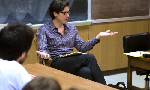 Instructor in front of classroom talking to class.