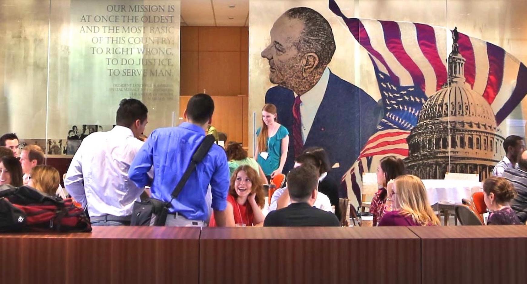 Students mingle inside the LBJ School of Public Affairs.