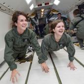 Aerospace engineering students in space simulation.