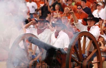 Texas Cowboys fire Smokey the Cannon at a football game.