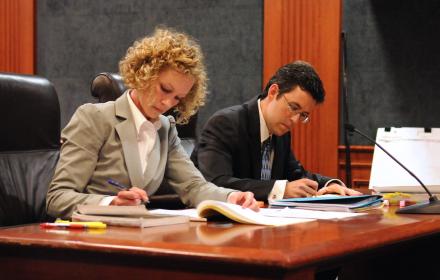 Lawyers preparing for case.