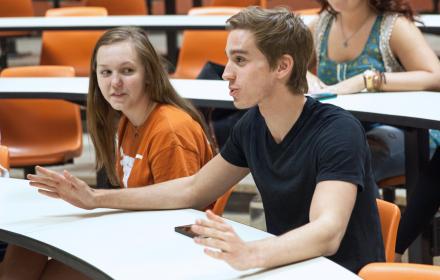 Student in class responding to instructor.