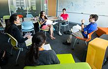 Dell Med students discussing project in classroom
