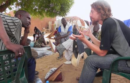Graduate student helping community members.
