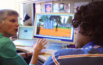 Student receiving training on computer program.