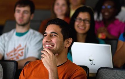 Students seated in auditorium classroom.